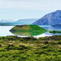 Landscape of Myvatn lake in Northern Iceland. Islet of volcanic pseudo crater is a middle.