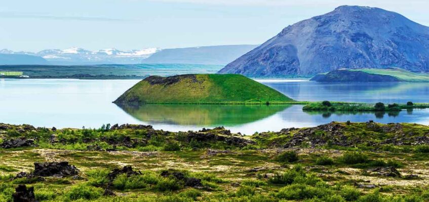 Landscape of Myvatn lake in Northern Iceland. Islet of volcanic pseudo crater is a middle.