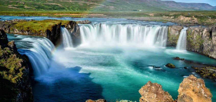 The Godafoss waterfall in summer displays its vibrant scene