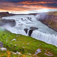 Panoramic view on Gullfoss waterfall on the Hvíta river, a popu Panoramic view on Gullfoss waterfall on the Hvíta river, a popular tourist attraction and part of the Golden Circle Tourist Route in Southwest Iceland. Golden Waterfall. Travelling concept background.