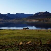 A typical Icelandic working farm situated in idyllic surroundings on the coastline of Dýrar fjord.