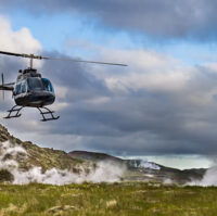 A helicopter flying over geothermal area