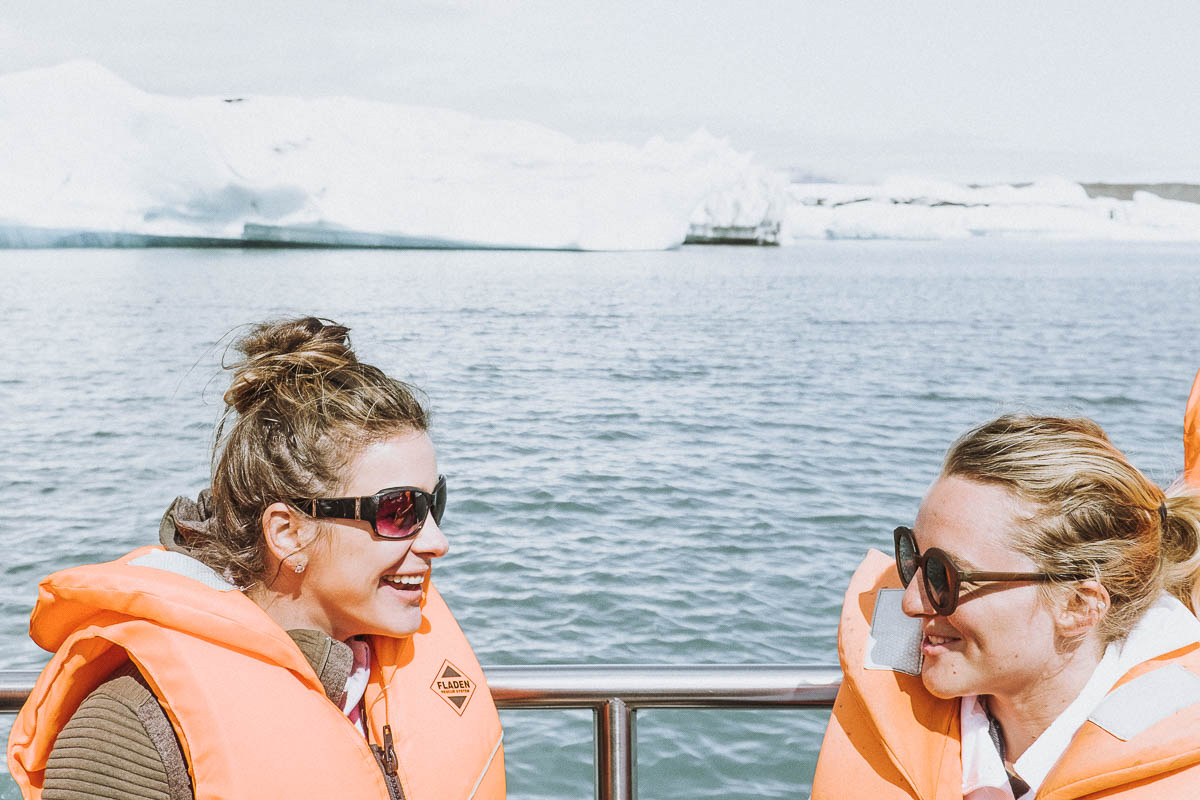 Women talking and smiling on a boat tour at the Glacier Lagoon