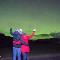 A couple watching the Northern Lights