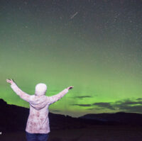 A woman enjoying the Northern Lights