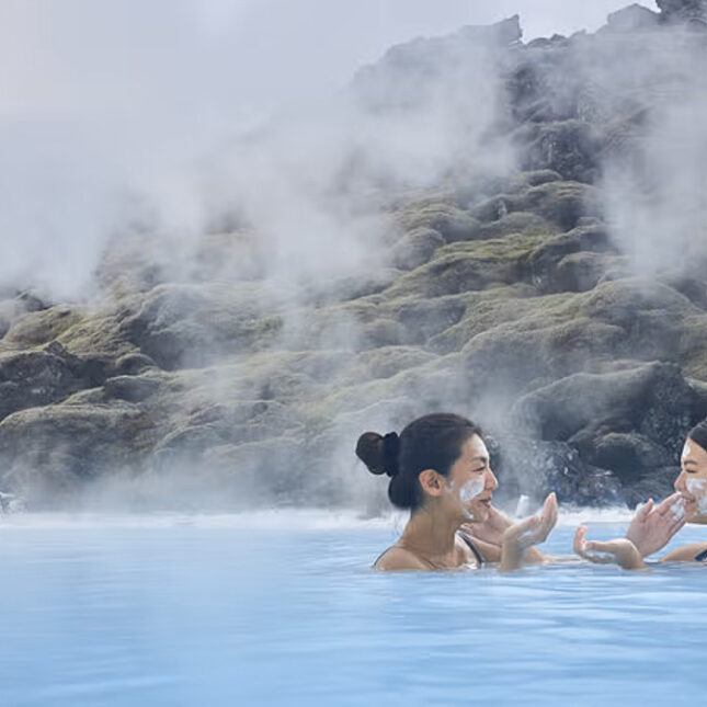 Women applying silica masks in the Blue Lagoon