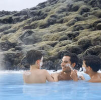 People applying silica masks in the Blue Lagoon