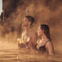 A couple having drinks at Sky Lagoon