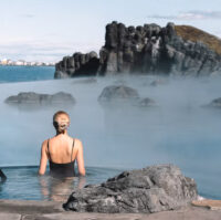 A woman at the geothermal spa Sky Lagoon