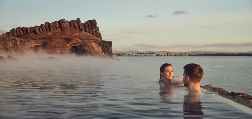 A couple relaxing at Sky Lagoon