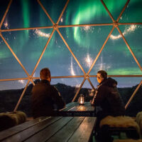 People watching Northern lights from Aurora base camp