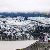 People on a viewing platform at Solheimajokull glacier