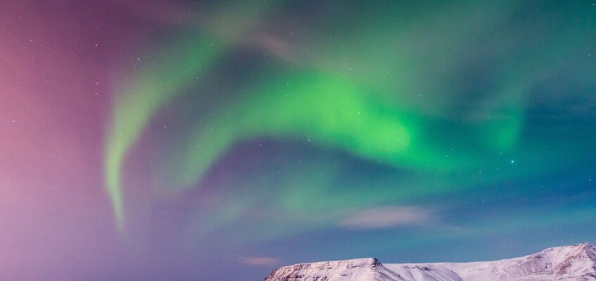 Amazing Northern Lights above mountains