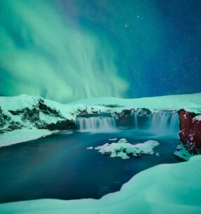 Goðafoss waterfall under the Northern Lights in winter North Iceland Goðafoss waterfall under the Northern Lights in winter North Iceland