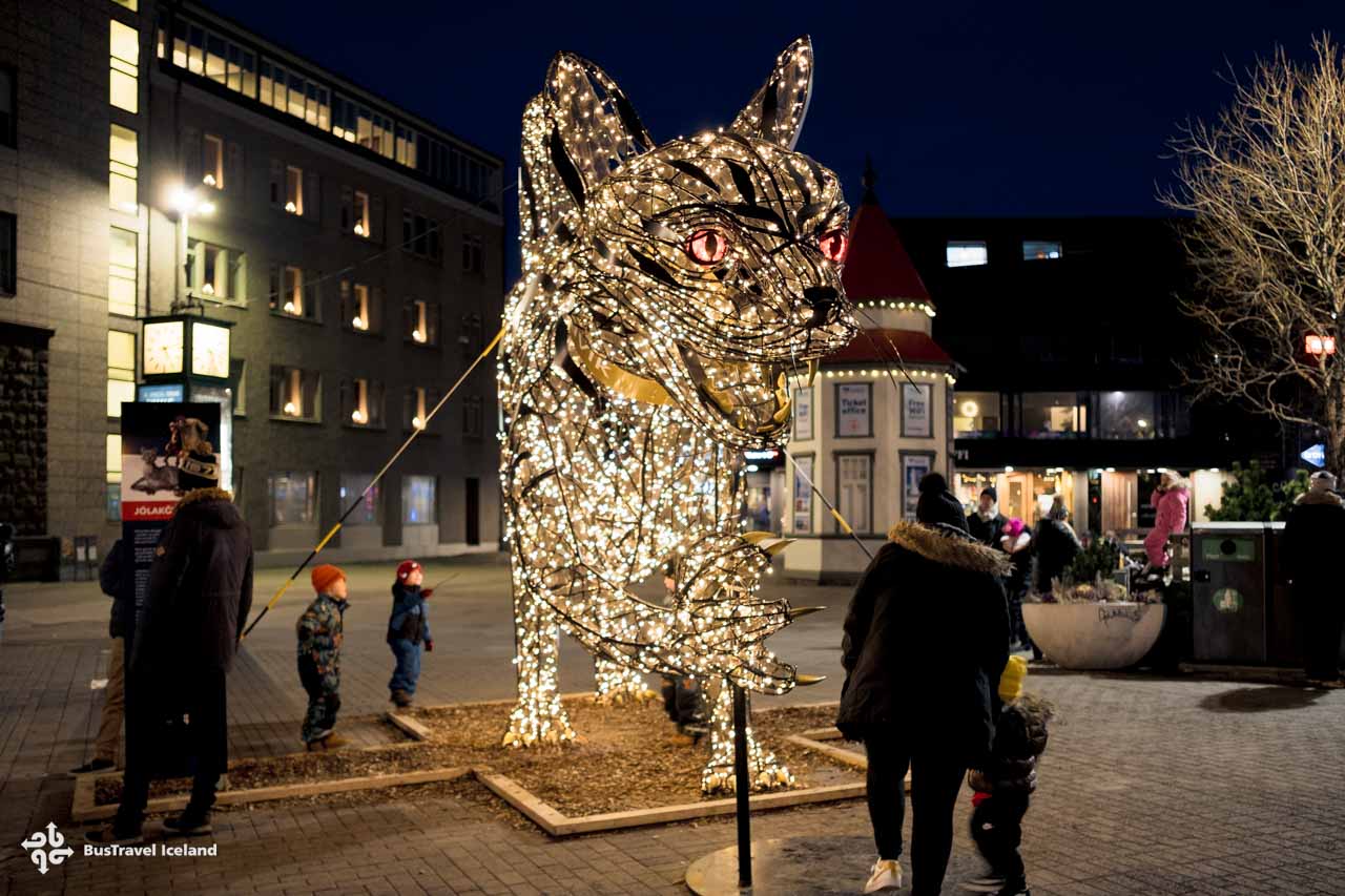 Kids loving the Christmas cat in Reykjavik Iceland