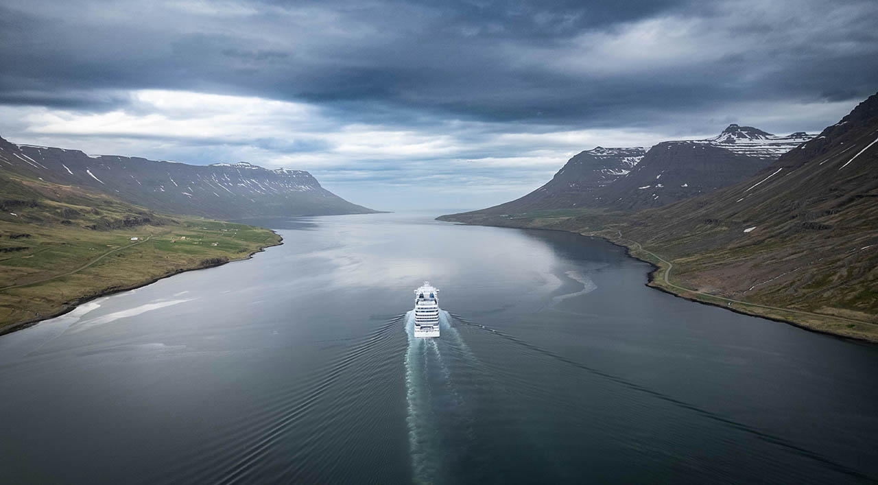 bernd-dittrich-cruise ship sailing in the fjord of Seydisfjordur east iceland A cruise ship sailing in the fjord of Seydisfjordur east iceland